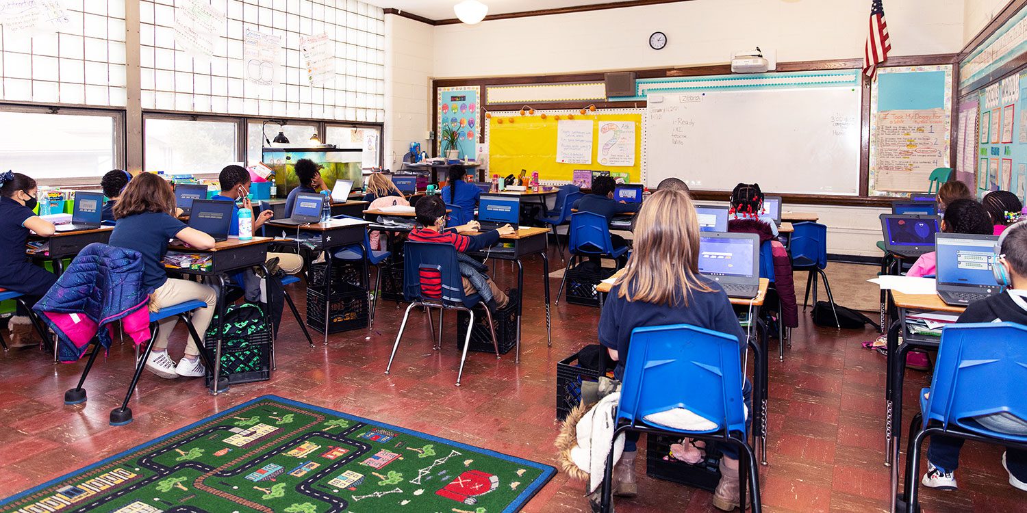 Students sitting at desks in a classroom.